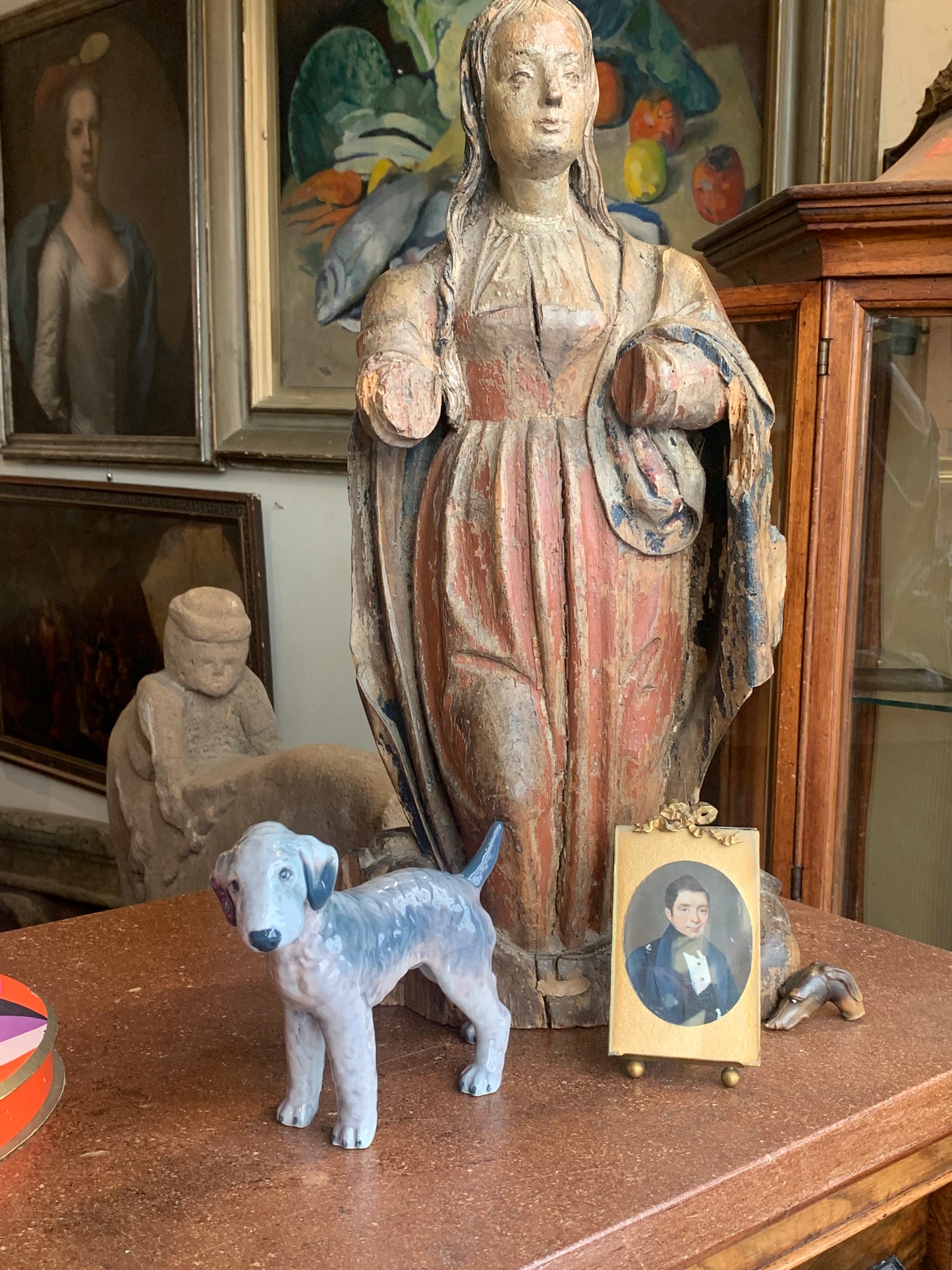 A miniature portrait of an elegant man in a black tie and pleated shirt with jewel buttons, dated 1833.