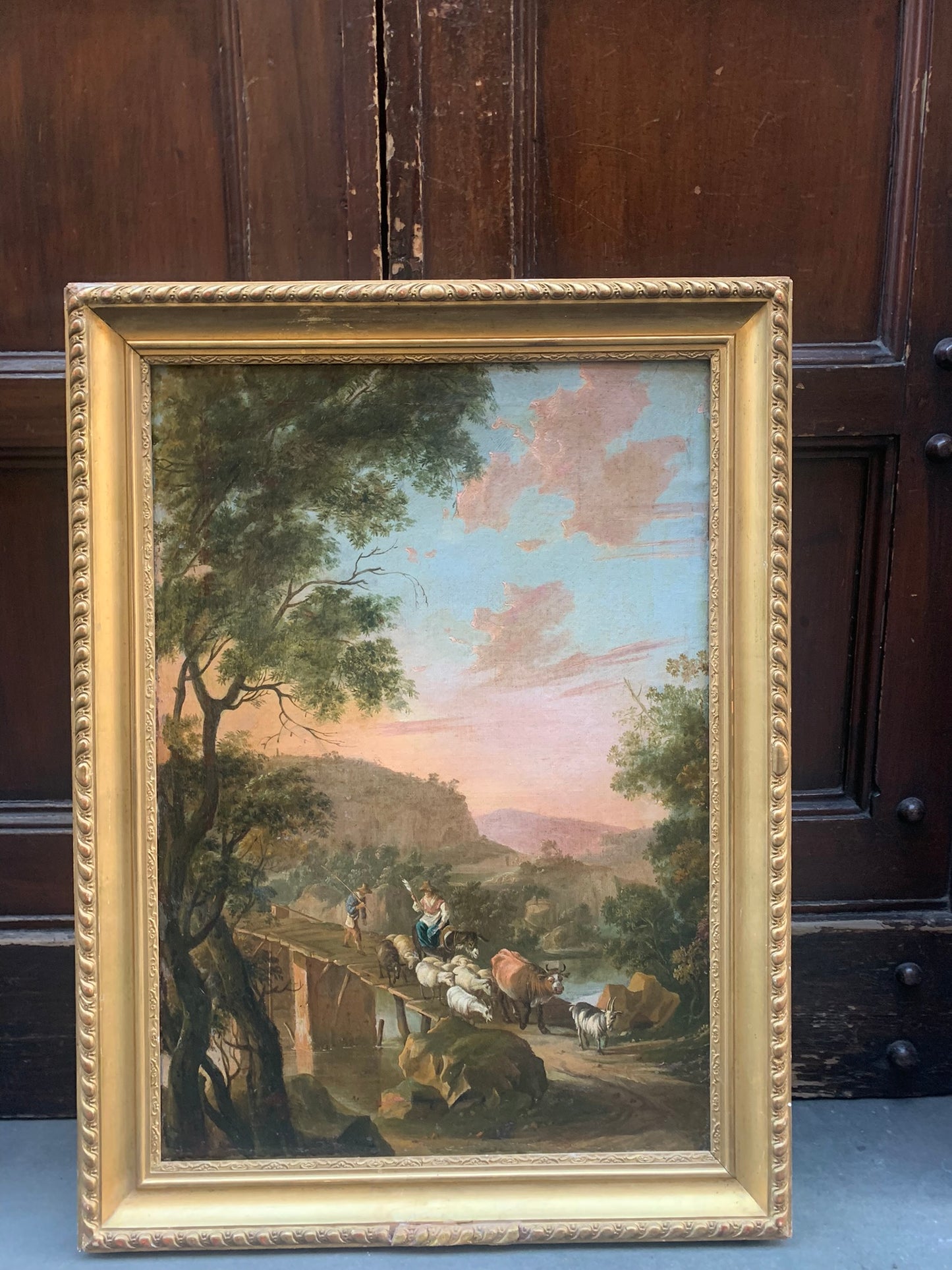 Circle of Jan Both  ( Utrecht, 1618-1652).  Italianate landscape with shepherd and a bridge