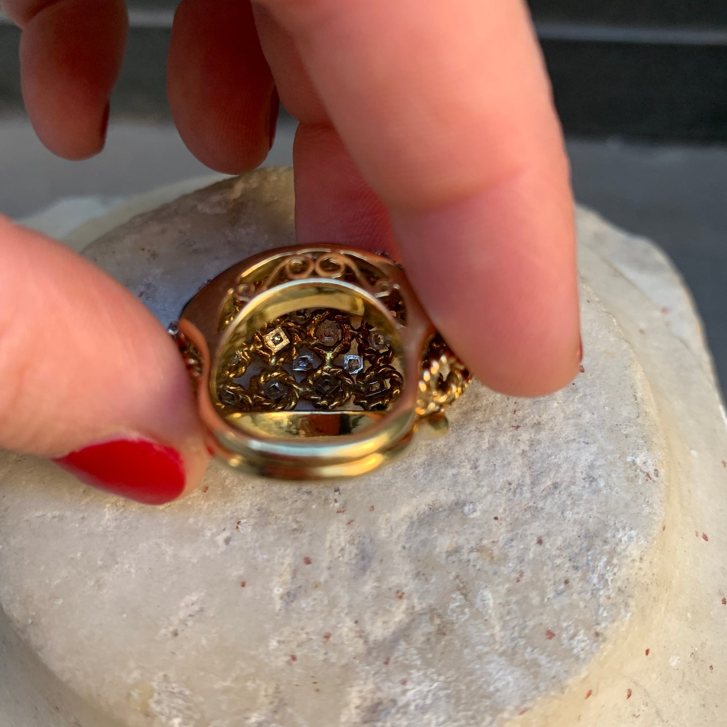 A dome ring with brilliant flowers and blue enamel.