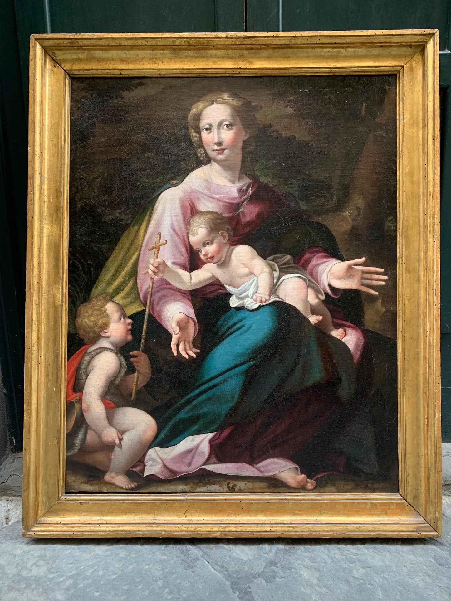 Late XVI century Madonna with child and St. John Baptist. Aemilian school.