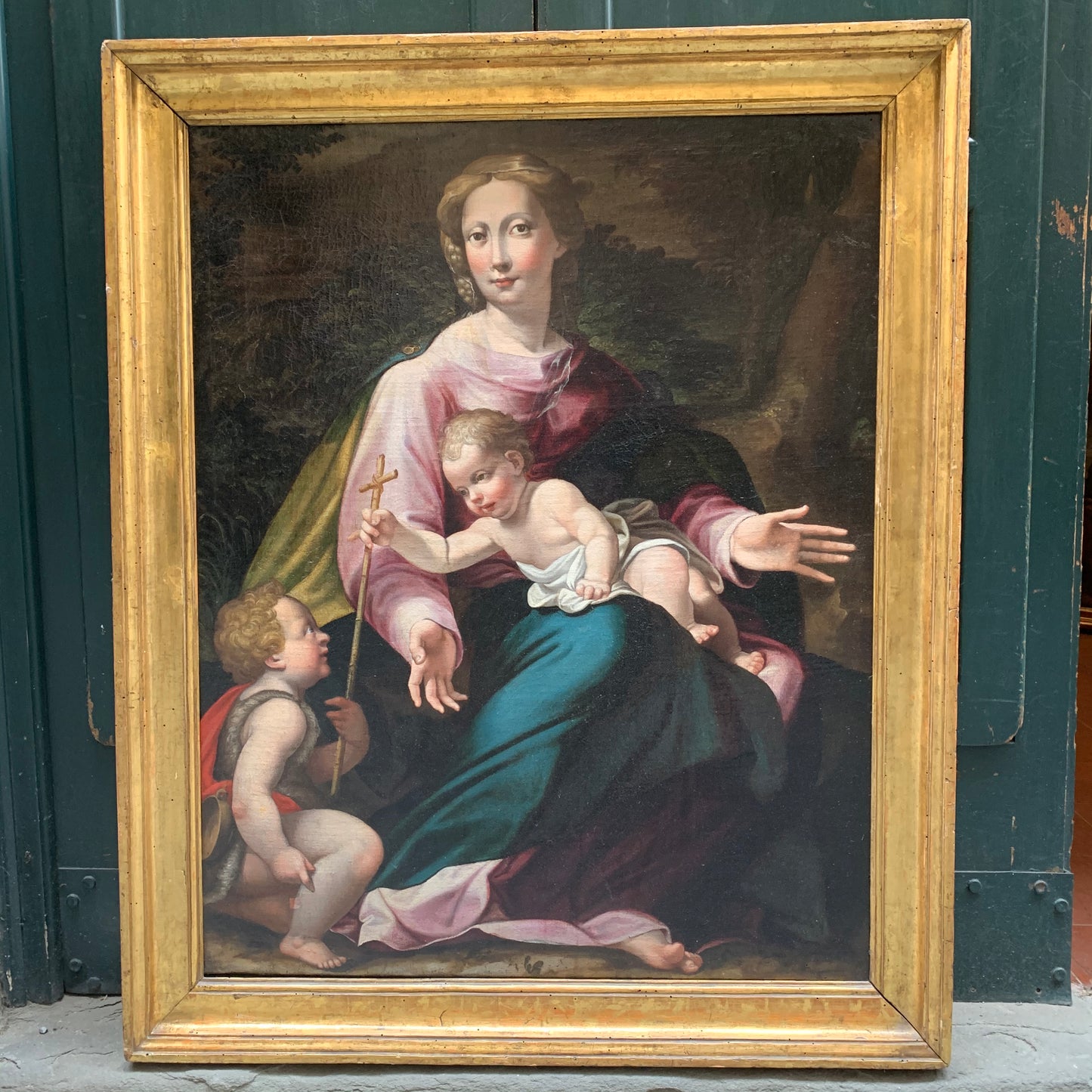 Late XVI century Madonna with child and St. John Baptist. Aemilian school.