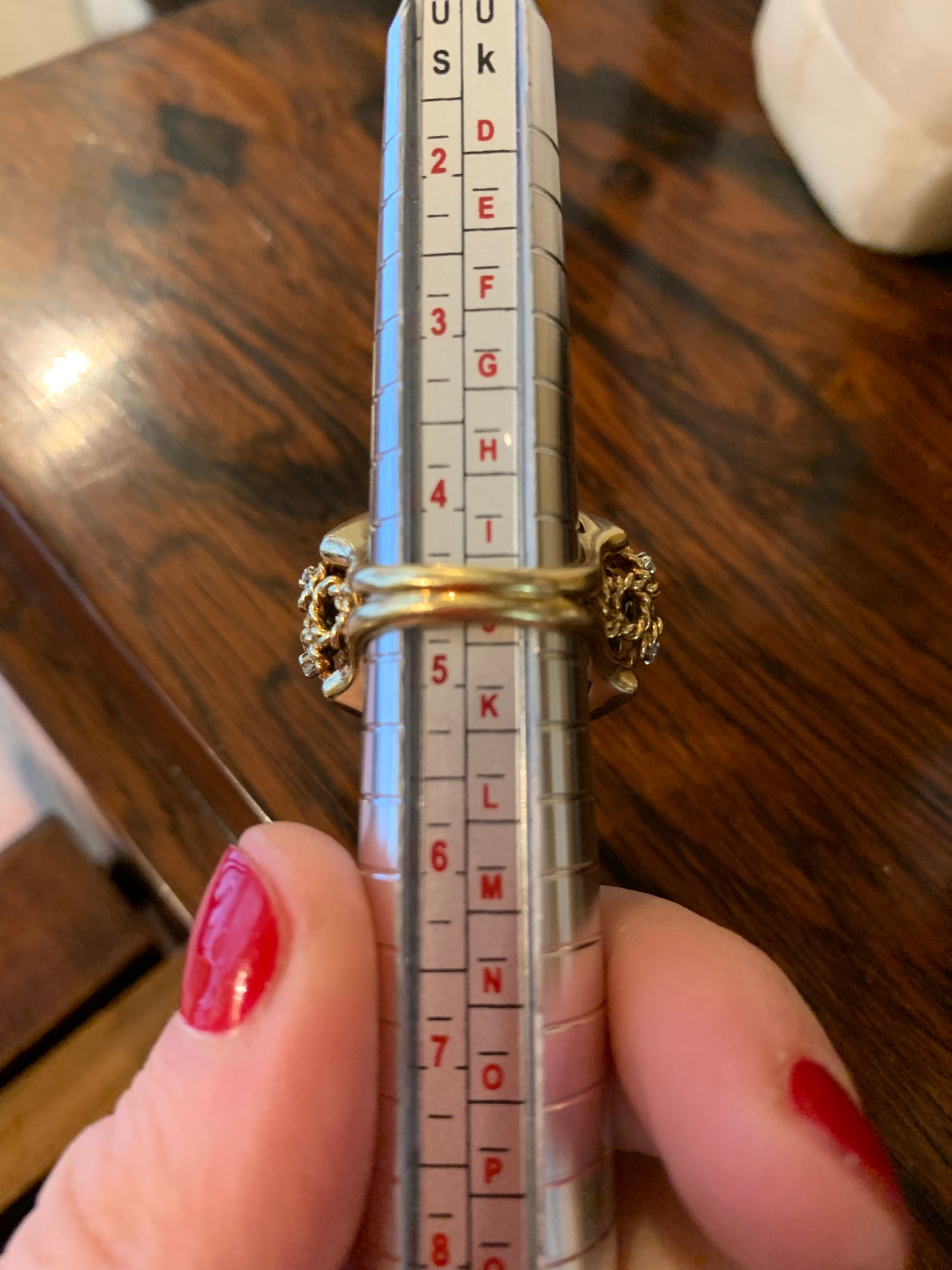 A dome ring with brilliant flowers and blue enamel.