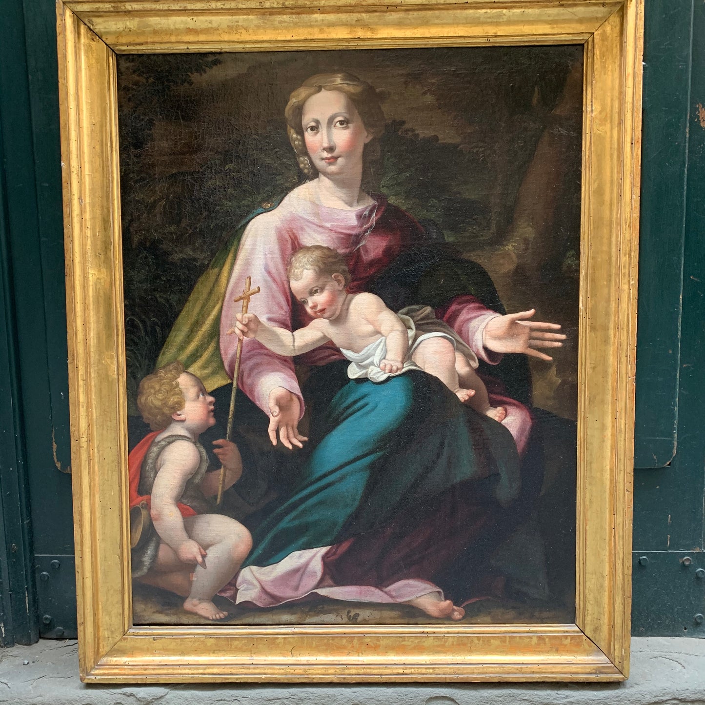 Late XVI century Madonna with child and St. John Baptist. Aemilian school.