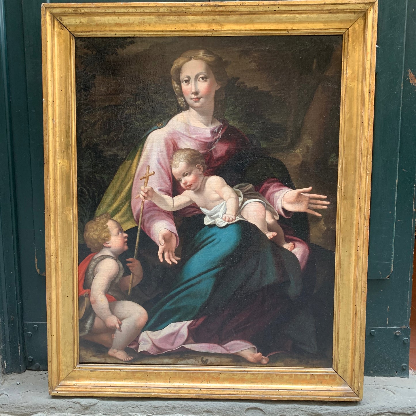 Late XVI century Madonna with child and St. John Baptist. Aemilian school.