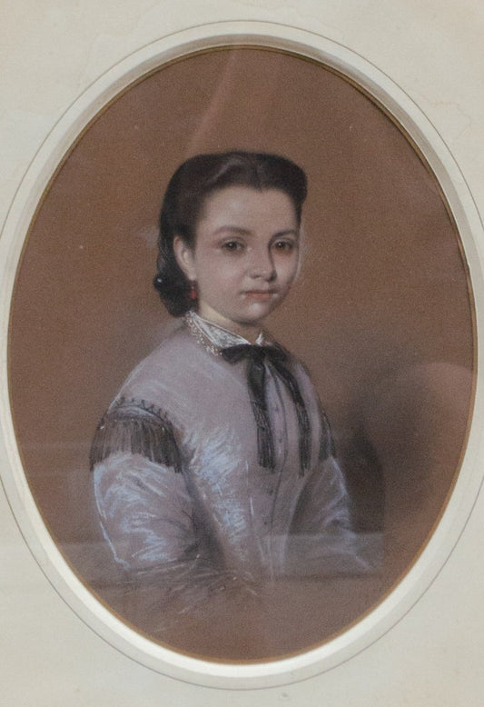 Portrait Of A Young Girl In A Lilac Dress With A Black Bow. Circa 1860.