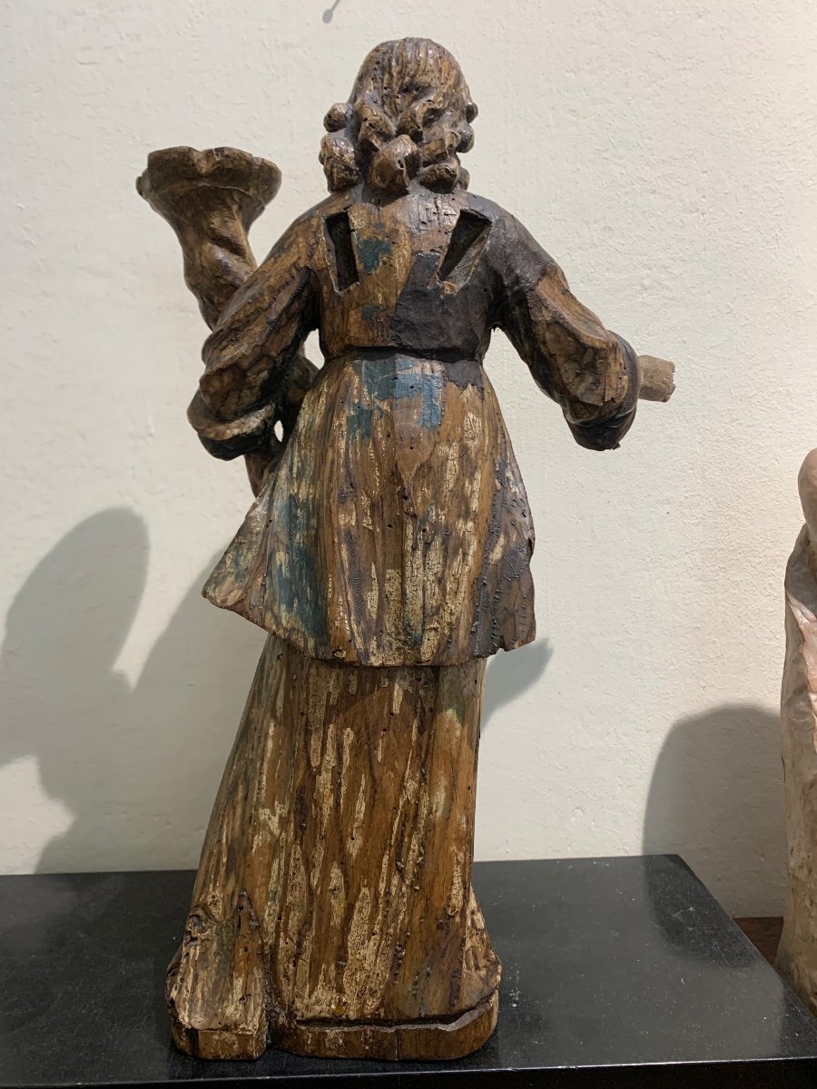 Angel candle holder, polychrome wooden sculpture, 17th century