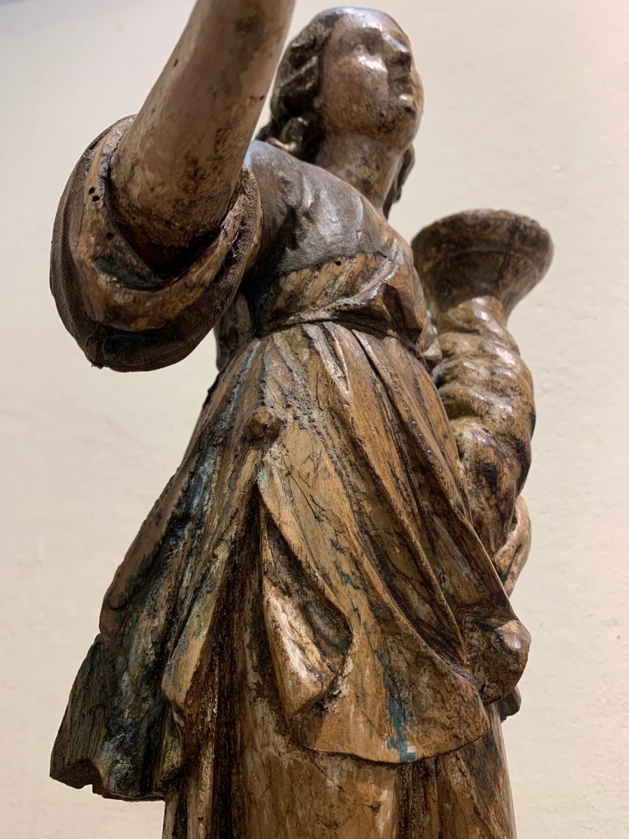 Angel candle holder, polychrome wooden sculpture, 17th century