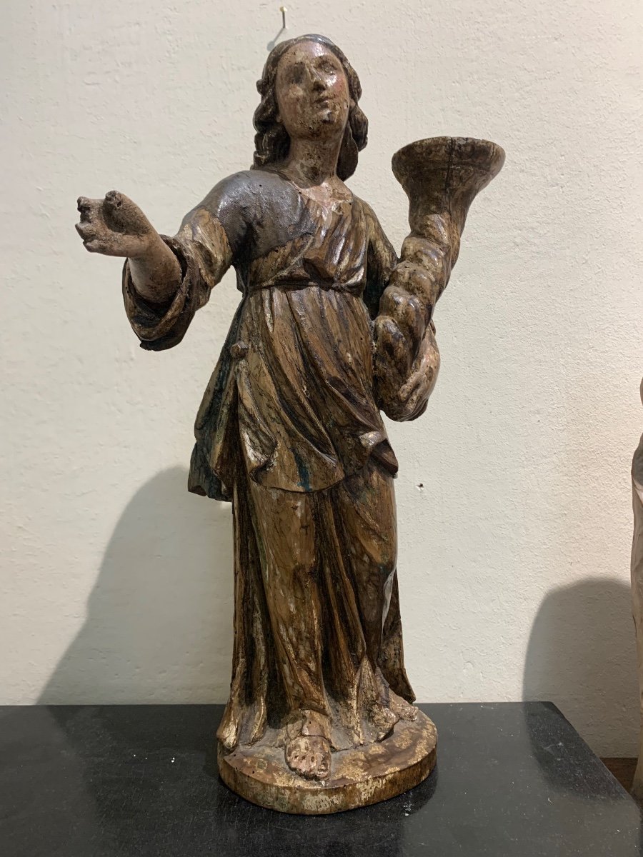 Angel candle holder, polychrome wooden sculpture, 17th century