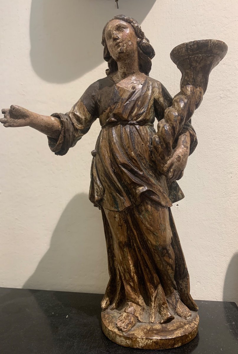 Angel candle holder, polychrome wooden sculpture, 17th century