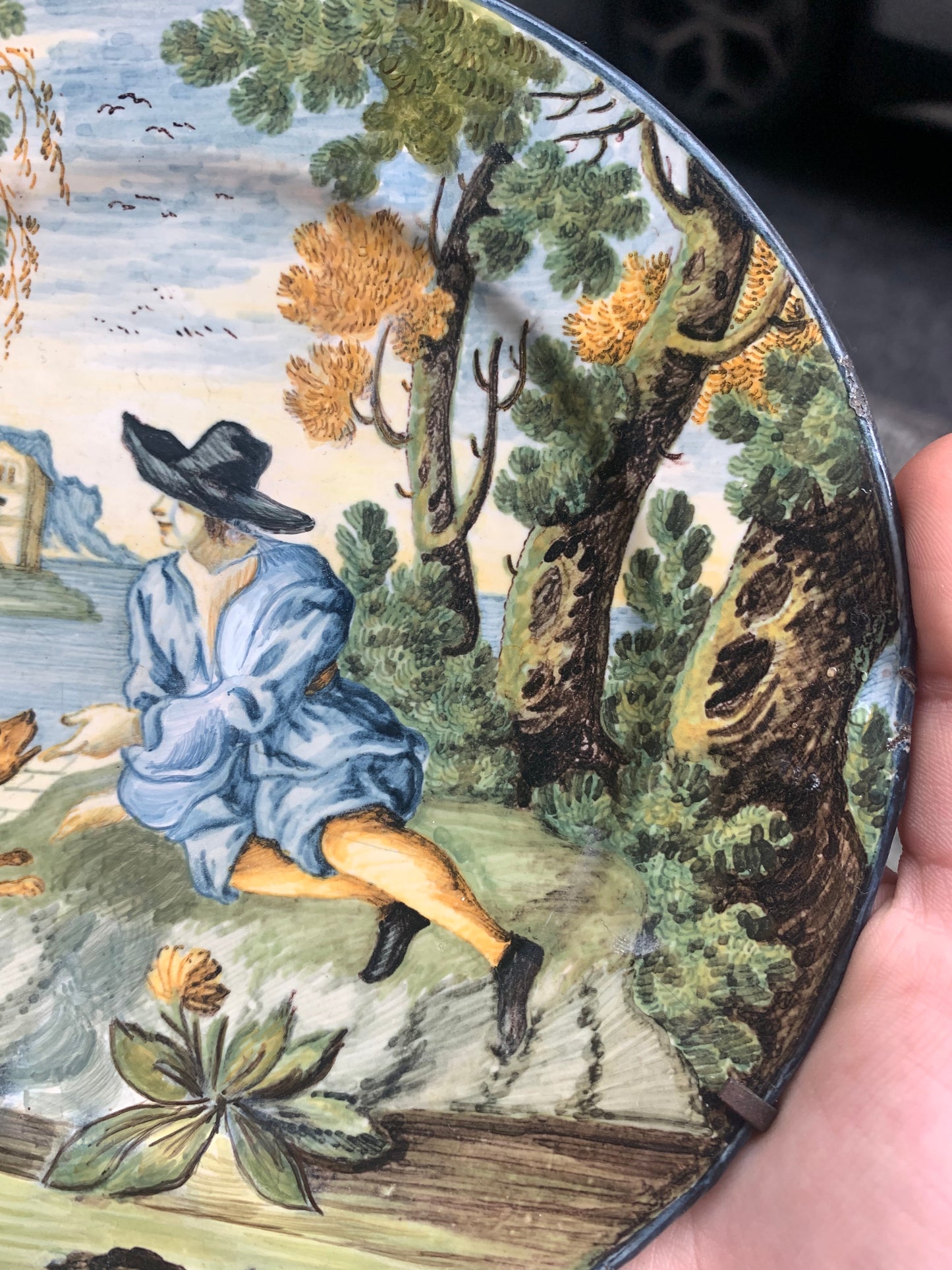 Castelli maiolica dish with young man in black hat, dog and classical ruins, mid-18th century