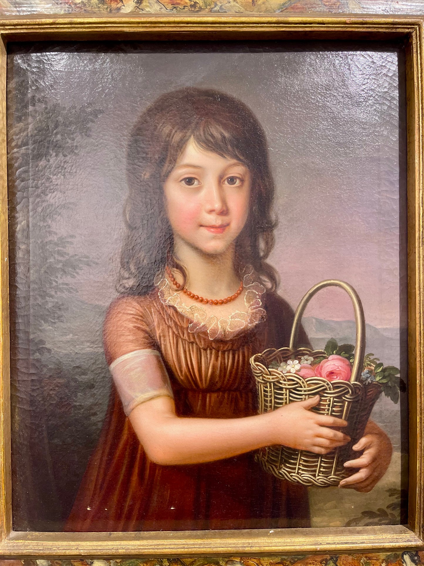 Portrait of a Young Girl with a Basket of Flowers and Coral Necklace, with the Bay of Naples in the Background