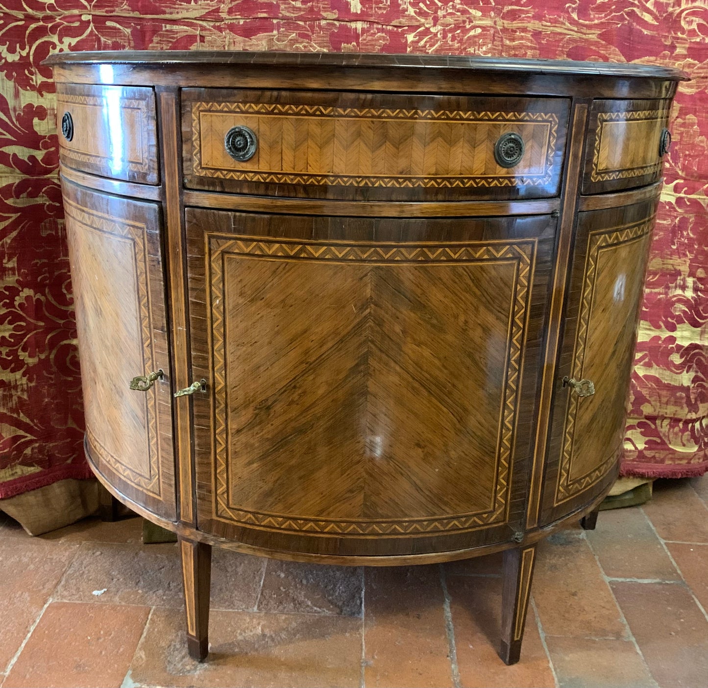 Late XVIII century Demilune Sideboard Veneered and Inlaid in different woods.