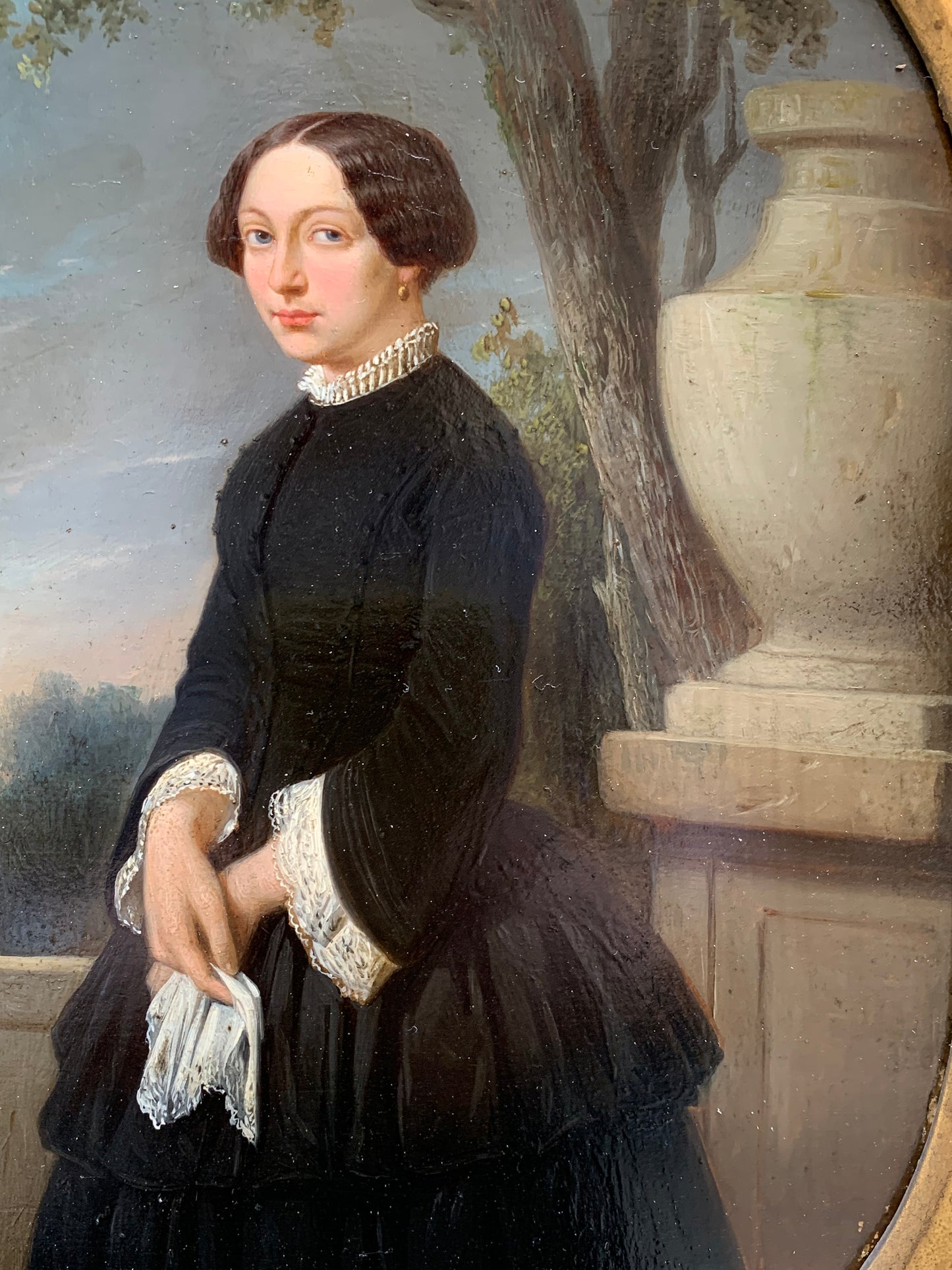 Portrait of an elegant woman in the park with at sunset. Circa 1845.