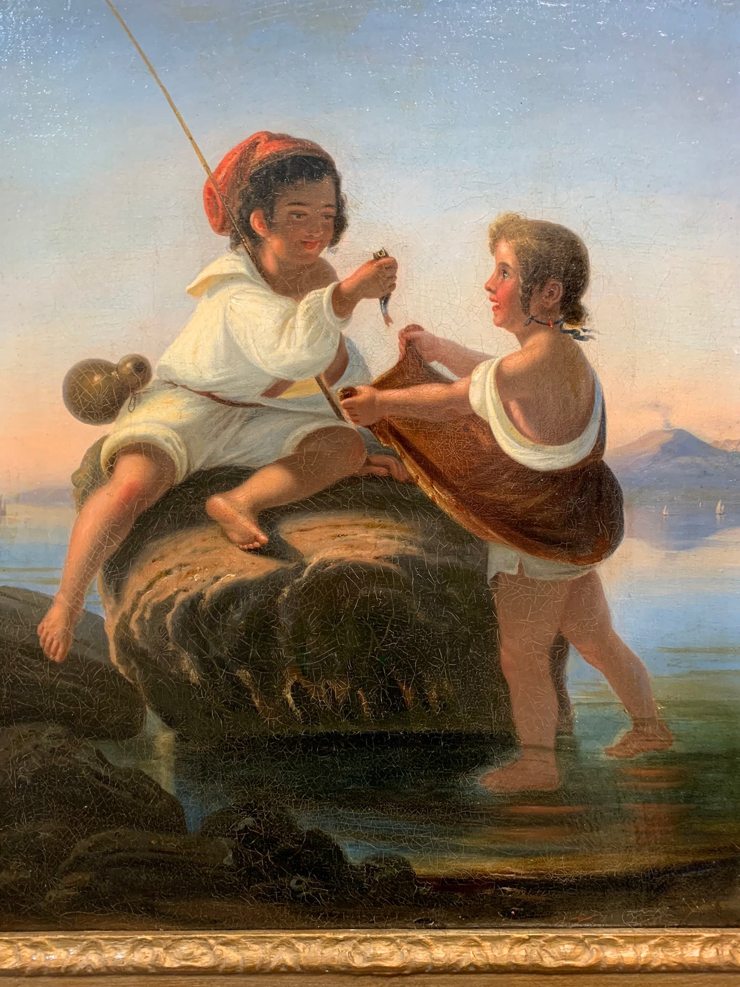 Small Neapolitan fishermen. 19th century.Gulf of Naples with the volcano of Vesuvius.