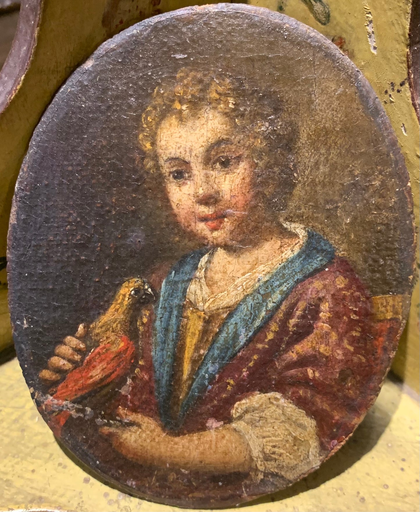 Portrait of a Child with a Bird.  Attributed to Antonio Amorosi (1660-1738)