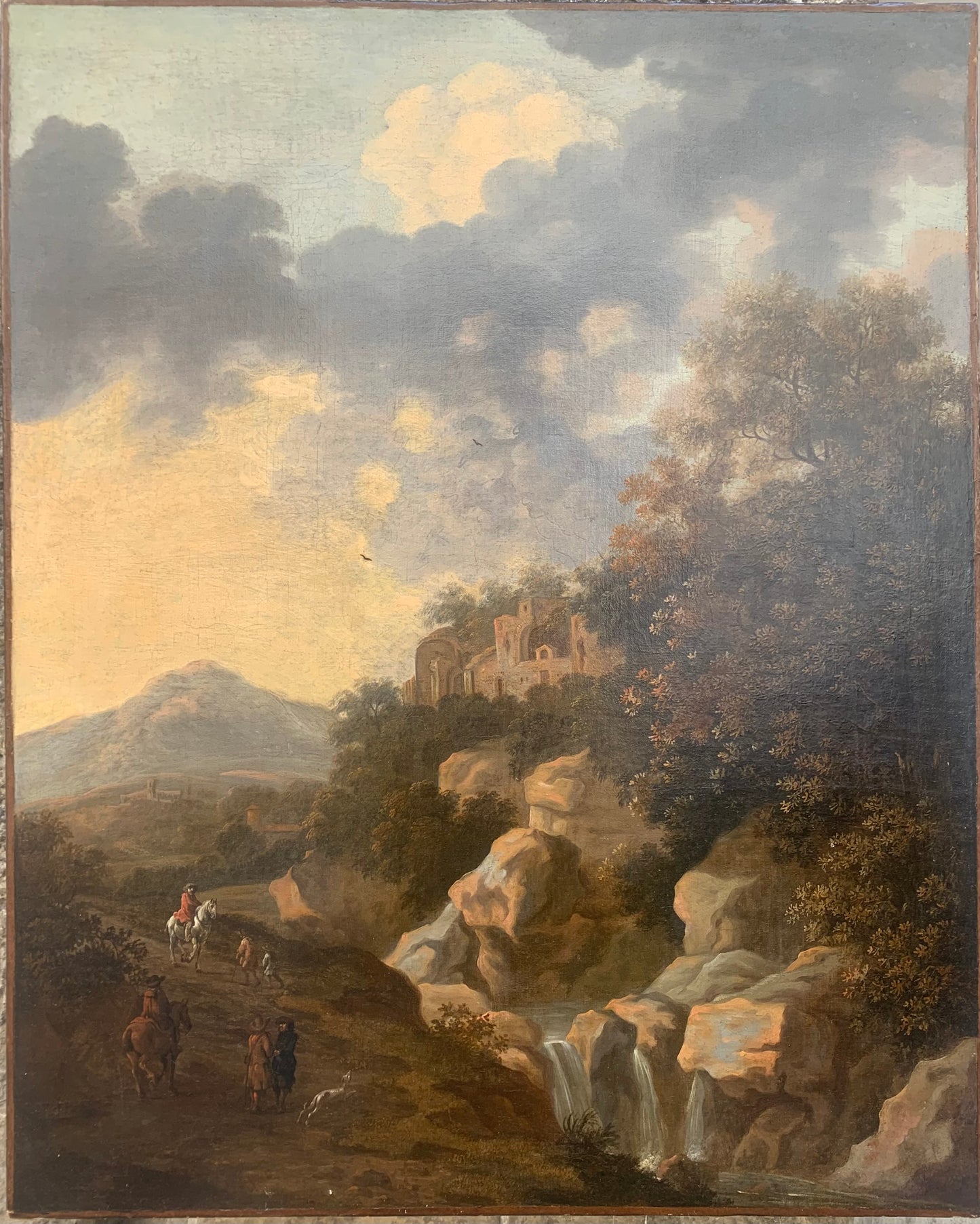 XVII century Dutch school Italianate rocky landscape with archaeological ruins and horse riders with dogs.