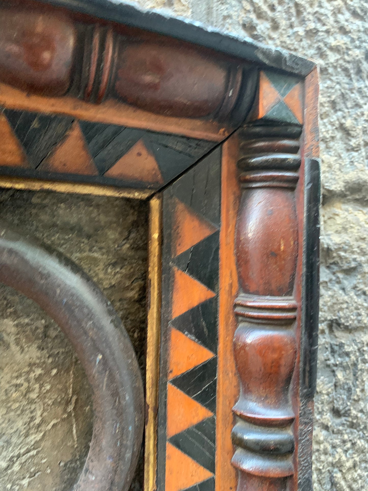 Unusual frame in various woods with geometric decorations.  Early 19 century