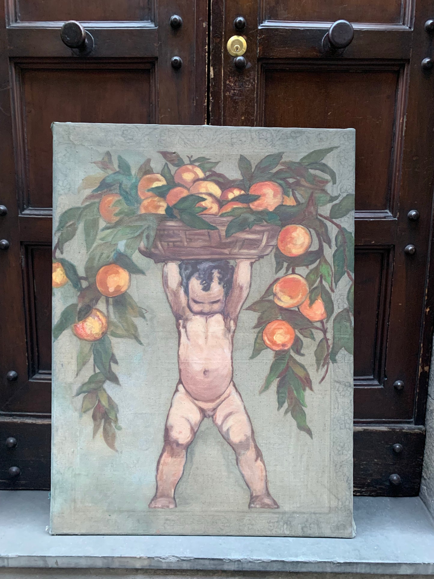 Art Deco Putto with fruit basket.